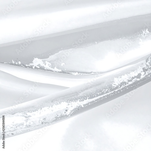 Dramatic aerial view of snow covered mountain peak.