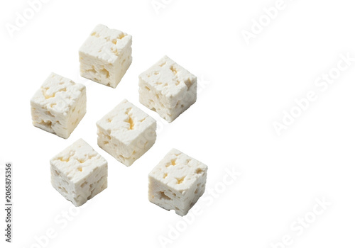 Six irregularly cut, roughly cubed pieces of fresh white feta cheese with crumbly texture, subtle shadows, isolated on a transparent background. Concept for gourmet food product photography