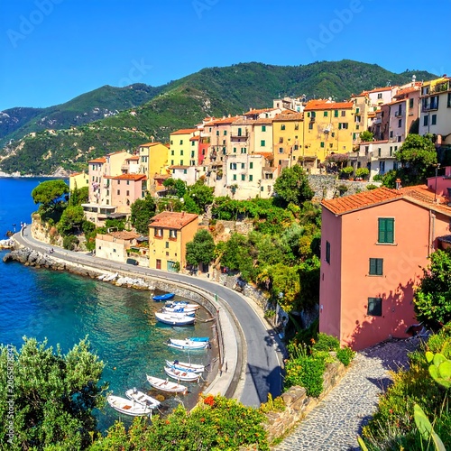Colorful Mediterranean village by the serene sea.