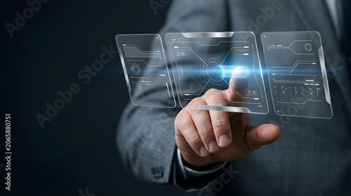 Businessman interacting with futuristic digital interface and data screens