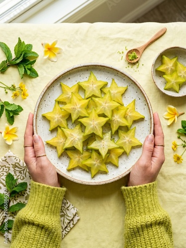 Vibrant Star Fruit Arrangement Held