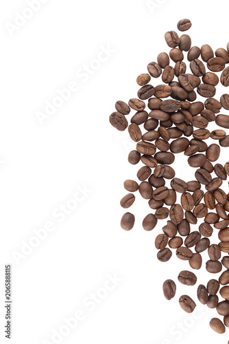 Coffee beans are piled on a white background, scattered across an empty space