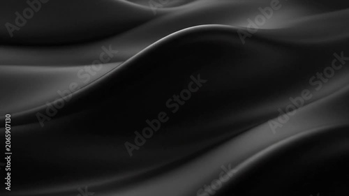Silky black fabric drapes in smooth waves creating deep shadows and elegant folds across a seamless surface.