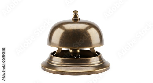 A shiny metal hotel service bell sits on a table indoors.