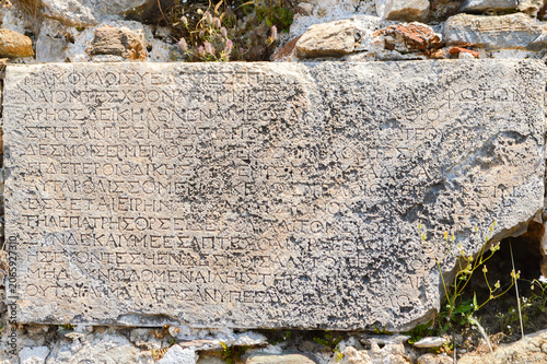 Canvastavla Ancient stone inscription from the Roman Empire period embedded in the archaeological ruins of Syedra Ancient City near Alanya, Türkiye