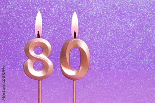 Number 80 on a pink background with blurred bright dots - Birthday or anniversary card with abstract blurred dots that glow