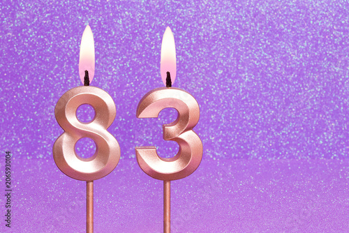 Number 83 on a pink background with blurred bright dots - Birthday or anniversary card with abstract blurred dots that glow