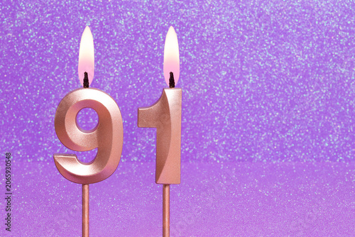 Number 91 on a pink background with blurred bright dots - Birthday or anniversary card with abstract blurred dots that glow