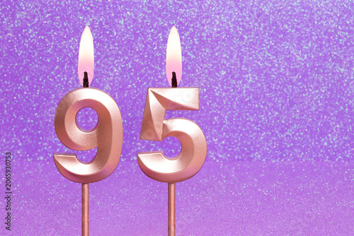 Number 95 on a pink background with blurred bright dots - Birthday or anniversary card with abstract blurred dots that glow