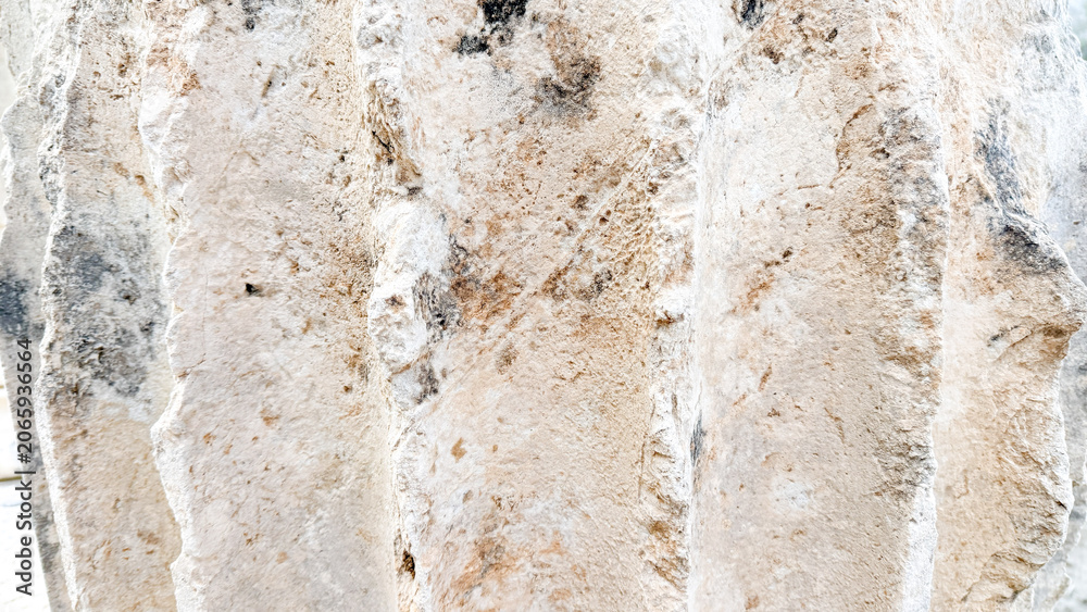 Obraz premium ured limestone wall in natural light with warm beige tones suitable for architectural backgrounds, texture overlays, editorial and product mockups, 5 May 2026 Subitica, Serbia
