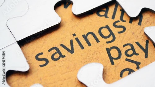 Savings Concept Revealed Through Puzzle Pieces and Financial Planning Text