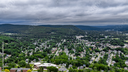 Oneonta, NY, USA - June 7, 2026: Late afternoon spring aerial photo of downtown, business district, Oneonta, NY on an overcast day.