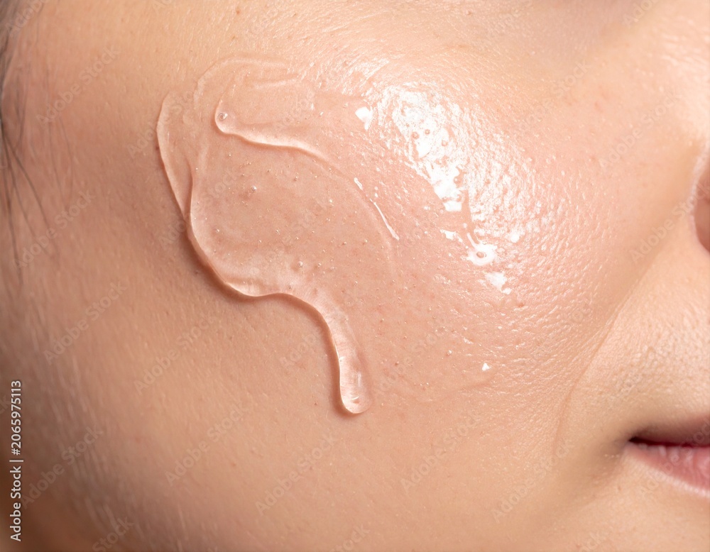 Fototapeta premium Clear Cosmetic Gel Smear on Human Skin Close-Up Skincare Application Concept