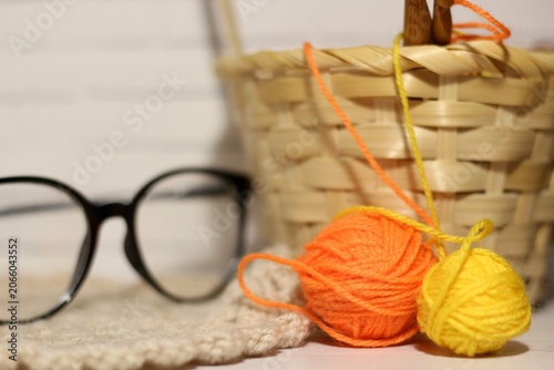 Quadro su tela Ball clew of wool glasses and a basket handmade creative photo art decor design