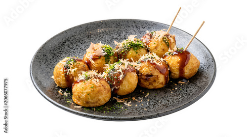 Takoyaki octopus balls with sauce and bonito flakes on dark plate takoyaki japanese streetfood appetizer delicious restaurant traditional gastronomy culinary snacking fishflakes flavorful