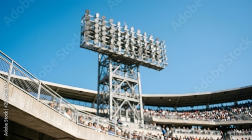 Stadium Lights Tower Against Clear Blue Sky