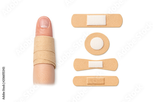 Wrapped finger with fabric bandage and adhesive bandages