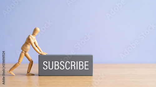 Mid-year performance review and employee evaluation concept with wooden mannequin pushing a business growth analysis block with copy space for HR corporate presentation slide