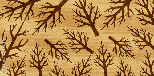 Fotografía artistic stylized brown tree silhouettes on textured beige paper