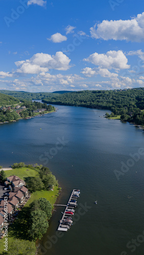 Aerial view of Deep Creek Lake surrounded by forest in western Maryland