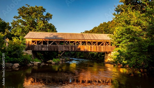 Wooden bridge over a stream at dawn