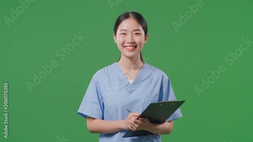 a young Asian Personal Health Attendant in Light Blue Scrubs