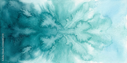 Tableau sur toile Abstract watercolor splash in shades of teal and turquoise creates a symmetrical, organic pattern reminiscent of ink blots or natural formations, evoking a sense of calm and introspection