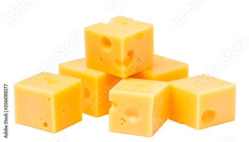 Yellow cheese cubes are stacked together in a pyramid on a white background, several holes visible