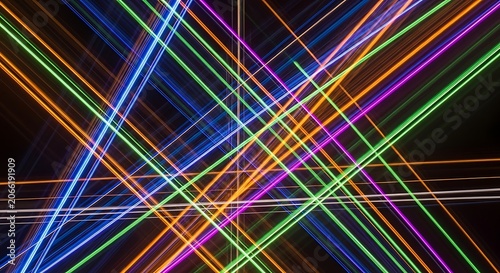 Vibrant multicolored neon light lines intersecting.