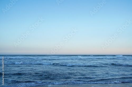 Vertical Blue Ocean Waves And Sky