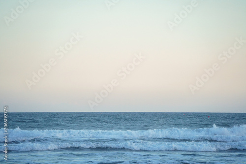 Calm Blue Ocean Under Pale Sky