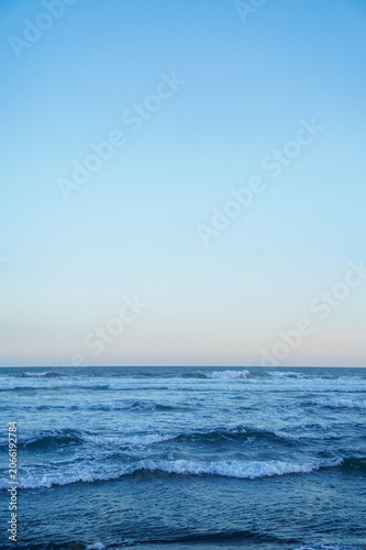 Vertical Blue Ocean Waves And Sky