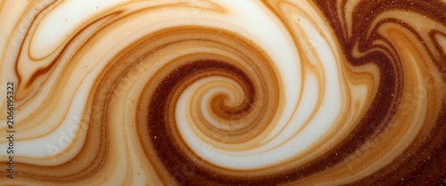 Detailed close-up of abstract swirling coffee and milk pattern with foam.