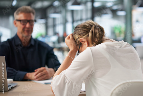 Photos Two Office Workers Discuss Hiring Mistake During Tense Disciplinary