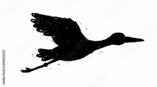 Bild auf Leinwand Silhouette of a flying bird with outstretched wings.