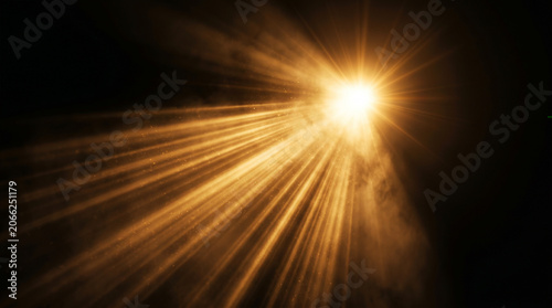 Brilliant golden light beams shining through dark atmospheric smoke creating a dramatic effect with intense rays and glowing warm particles