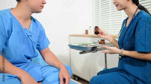 Professional nurse giving medication and healthcare advice to a patient in hospital. Medical care, recovery, treatment, nursing support and wellness concept.
