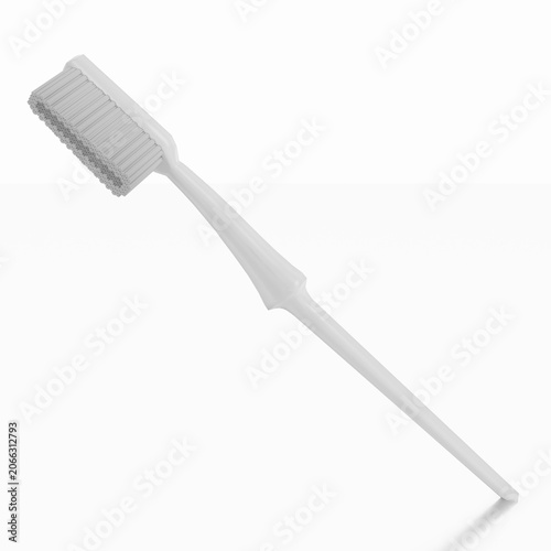 Spazzolino da denti su sfondo bianco con riflesso.
