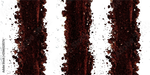 Tableau sur toile Three vertical lines of rich, dark coffee powder create a striking abstract pattern, suggesting the intense flavor and aroma of freshly ground beans