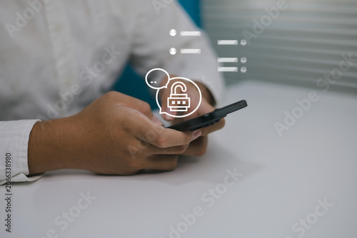 Photos Man holding using mobile messaging security encrypted chatting communication, da