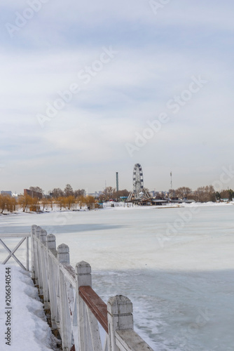 Frozen urban lake in spring