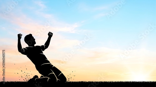 Silhouette of a triumphant soccer player celebrating victory on a field at sunset, with arms raised in joy and achievement.