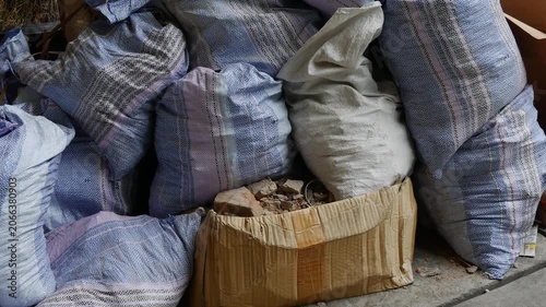 Construction Waste Bags and Rubble Cardboard Box on Ground Urban Renovation Scene
