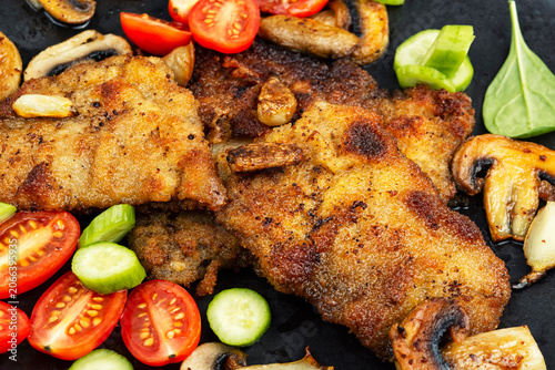Delicious golden brown breaded pork chop.