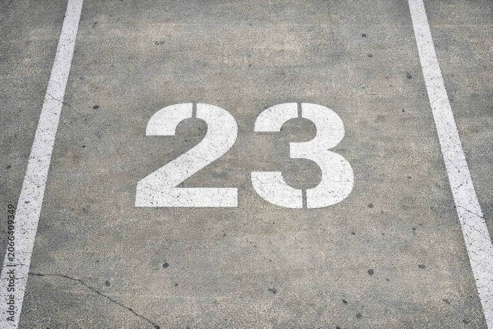 Fototapeta premium A numbered parking spot in a busy parking lot