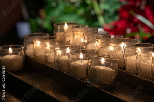 Burning votive candles in a quiet church interior

Description
Burning votive candles in glass holders creating a warm spiritual atmosphere for prayer, remembrance and quiet reflection.