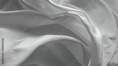 Elegant white silk fabric swirling in a graceful abstract pattern