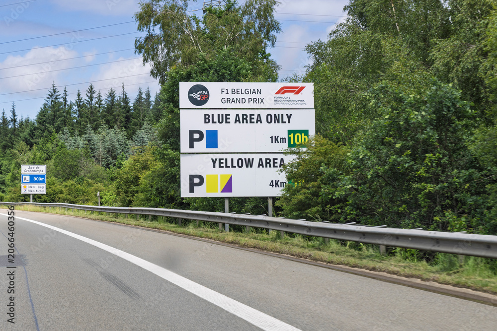Naklejka premium Cronchamps, Belgium - June 5, 2026: Large parking informational sign for the F1 Belgian Grand Prix at Spa-Francorchamps alongside the highway.