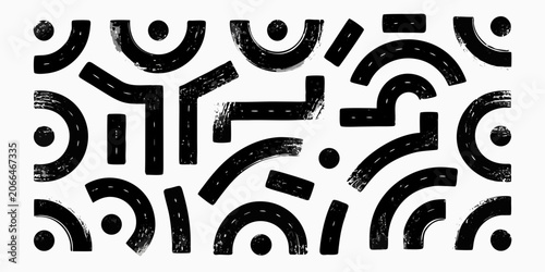 Black ink stamp shapes on a white background abstract pattern