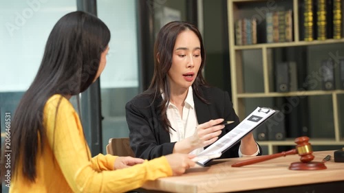 Attorney and client discussing legal matters during a consultation, highlighting legal advice, dispute resolution, professional guidance, and client-focused legal services.